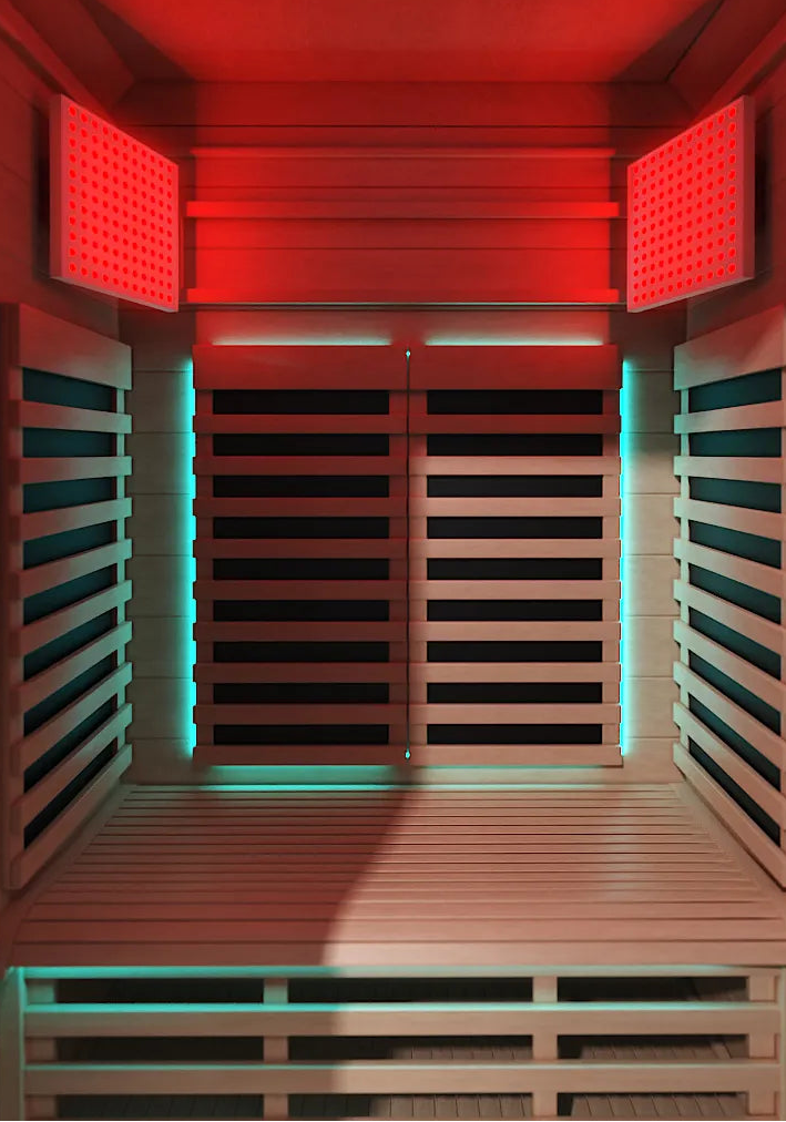 interior of the Coldture POD infrared sauna with red light panels lit